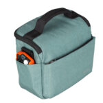 Dulepro Companion Shoulder Bag S22 light green linkerzijaanzicht met zijvak en compacte oranje accessoire